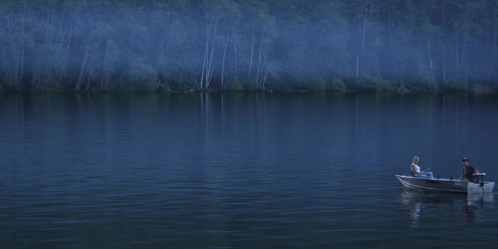 Man and woman in boat trolling for fish