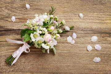 Romantic bouquet with flowering twigs of apple tree, lilly of th