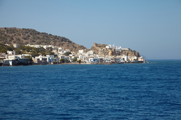 Fototapeta na wymiar View from the sea to the town Mandraki