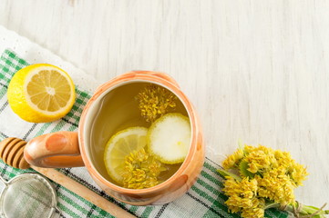 Tea of linden trees with fresh flowers and lemon