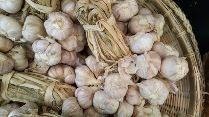 Garlic in wooden basket in the market