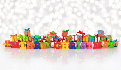 Merry christmas colorful text on the background of varicolored g