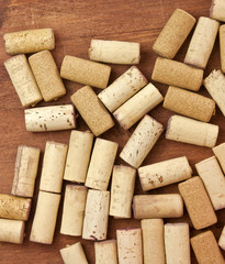 Wine corks, shot from above on dark wooden background texture