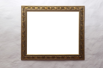 Golden frame at the white wall 