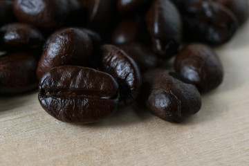 Coffee beans on wood background