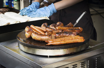 Street food, sausages on grill