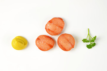 sausage slices and mustard