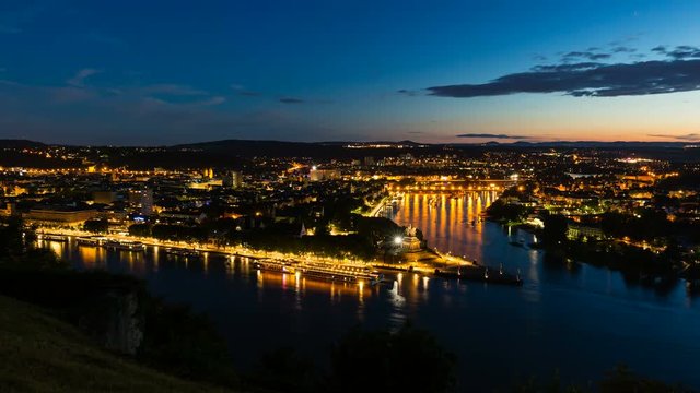 Timelapse sequence of Deutsches Eck and the oldtown of Koblenz, Germany with  Rhine and Moselle River in the night in 4K, zooming in.