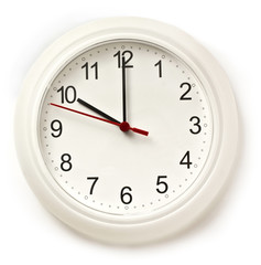 Typical office white clock with hands pointing at 10