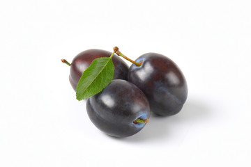 three ripe plums