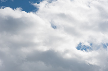 Blue summer sky with white clouds, natural background.