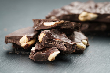 broken homemade bar of chocolate with cashew nuts reverse side