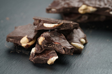 broken homemade bar of chocolate with cashew nuts reverse side