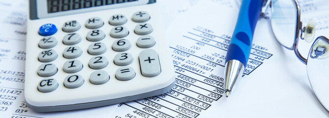 Financial accounting with paper reports and calculator