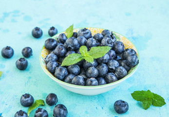 Fresh blueberries with mint leaves