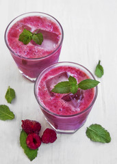 Iced raspberry smoothie with mint leaves
