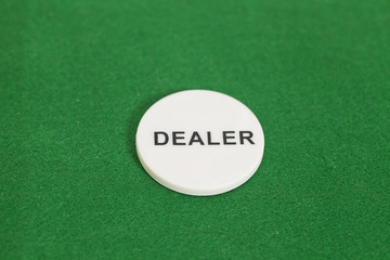 Dealer poker chip  on a game table in a casino
