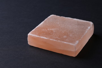 Salt soaps on black background. Close up