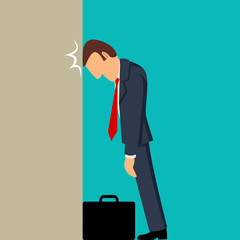 Businessman knocking his head against wall