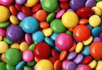 Many colorful candy as background.