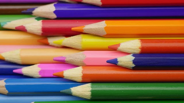 Color pencils lay down into box.
