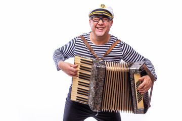 Sailor showman singer with musical instruments drum and accordion on white back