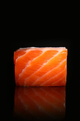 Fresh salmon piece isolated on black background. 