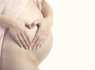 Pregnant Belly with fingers Heart symbol