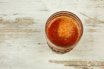 Gass of fresh tomato juice, flat view