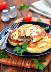 Potato cakes with meat and onions