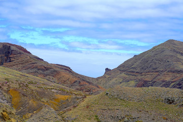 multi-colored rock with sky view
