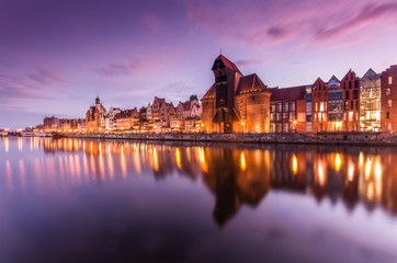 Obraz premium Gdansk old town with harbor and medieval crane in the evening.