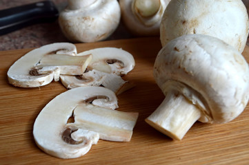 Fresh mushrooms on wooden background