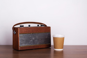 Old retro style radio on a wooden surface