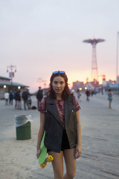 Portrait of a young woman at the boardwalk