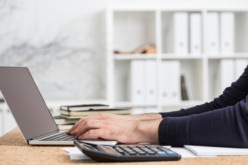 Fototapeta na wymiar Accountant using mockup laptop