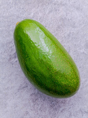 Fresh avocado on stone background. Organic avocado healthy food