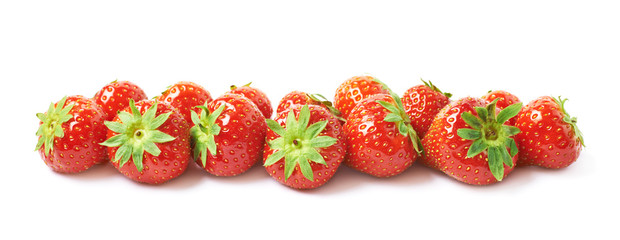 Line of red strawberries isolated
