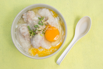 porridge rice gruel in bowl with pork