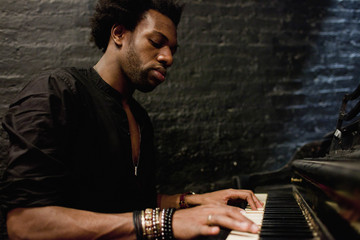 Young musician playing a piano