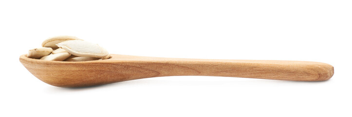 Wooden spoon full of pumpkin seeds
