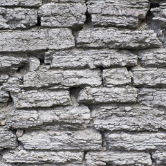 Fragment of an old brick wall