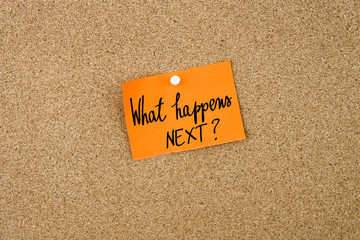 What Happens Next ? written on orange paper note - 114884137