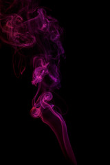 Abstract purple smoke from aromatic sticks.