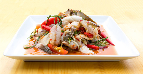 Green Papaya Salad (Som tum Thai) mixed with seafood and mushroo