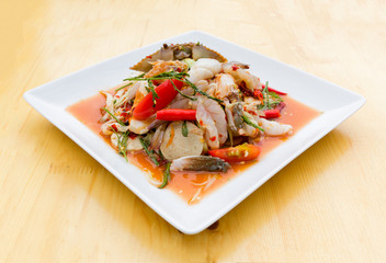 Green Papaya Salad (Som tum Thai) mixed with seafood and mushroo