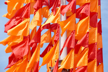 Festive flags of red and orange color