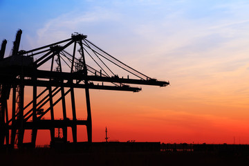 Fototapeta premium in the evening，Freight dock of container crane