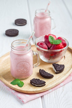 Strawberry cheesecake smoothie with cream cheese and milk, vertical