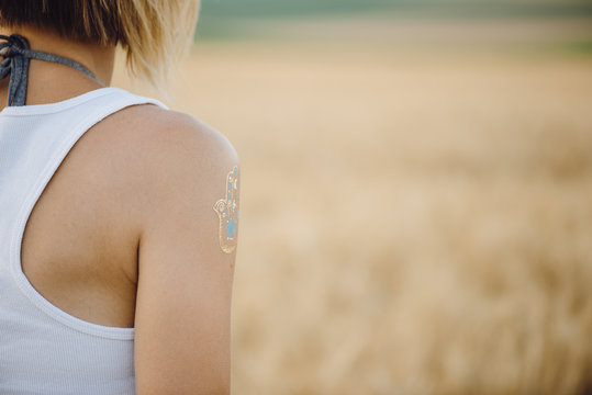 Close Up Woman Shoulder With Summer Tattoo